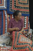 Woman embroidering traditional textile