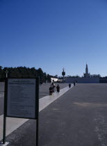 Pilgrims approaching shrine on their knees whilst praying