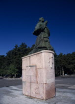 Statue of a praying Pope Paul on plinth.