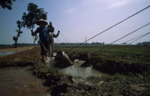 Irrigating paddy fields along the road to Ha Bac.