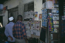Stone Town.  Two men at a newspaper stall.