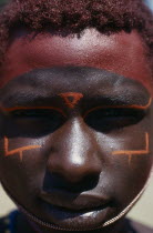 Portrait of Samburu moran with traditional face paint