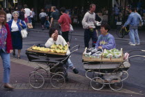 Street traders selling fruit from prams
