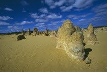 Rock pinnacles in desert landscape.