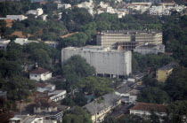 Elevated view over city architecture and the large white United States Embassy building