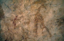 Detail of prehistoric rock art depicting giraffe and hunter.