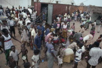 People displaced by civil war attempting to recover cooking oil spilt in queue for UN food aid.United Nations World Food Programme