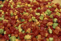 Display of chilies for sale in covered market.Cte d Ivoire