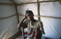 Portrait of woman in refugee camp for Sierra Leonean  refugees suffering from malaria.