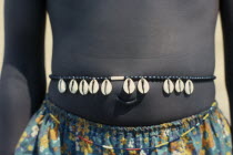 Cropped shot of Dinka girl wearing cowrie shell belt to indicate puberty.