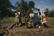 Women and children at well.