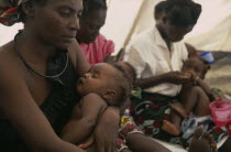 Mothers and babies in feeding centre for malnourished children in camp for Angolan refugees.Center