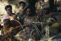 Somali women making basket from woven fibres in Dadaab refugee camp.East Africa