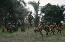 Chokwe tribe masked dancers  drummers and stilt walker.Tcokwe Zaire