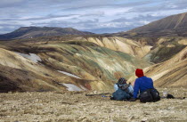 Colourful Rhyolite Mountains and trekkers admiring the view Landmannalaugar. Colorful