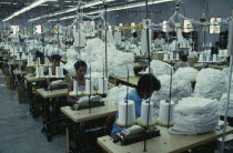 Dominican Republic, Interior of clothing factory with female workers seated at machines.