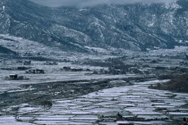 Agricultural landscape in winter snow.
