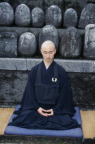 Buddhist Monk in Half Lotus position