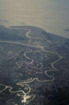Aerial view over meandering river and tributaries.