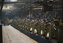Factory interior with workers at machines