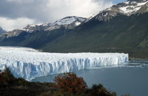 Jagged ice cliffs and mountainous landscape of the Perito Moreno Glacier.