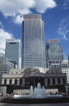 Canary Wharf  view looking up at the tower and surrounding architecture with fountain in the foreground