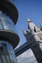 City Hall  detail of the curved exterior and Tower Bridge in the background