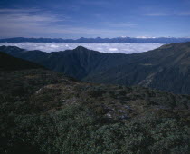 View from above towards mountain peaks.