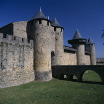 Fortified old town walls Chateau Comtal General view including bridge across dry moat
