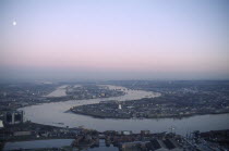 Aerial view from Canary Wharf over the River Thames towards the Thames Barrier in the early morning city smog