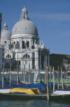 Grand Canal. Church of Santa Maria Della Salute seen from across water and empty Gondola boats
