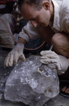 Quartz dealer examining a crystal