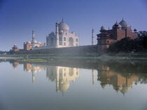 The Taj Mahal seen from across the Yamuna River with its reflection across the water