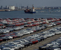 Southampton Docks. Rows of imported cars with container ships and boats on the waterAutomobile