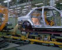 Ford Orion Car Production. Interior of factory with the shell of a silver car on production line.Automobile
