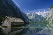 A boathouse amidst tranquil water on the far side of the Obersee.KnigsseeKnigssee
