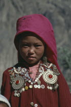 Head and shoulders portrait of young Kirghiz girl.Paleo-Siberian women ger yurt