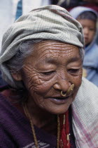 Elderly Limbuni tribeswoman wearing traditional gold Limbu nose jewellery