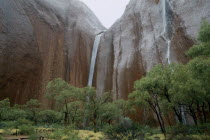 Ayers Rock.  Waterfalls at Maggie Springs or Mutidjula caused by rainstorm.