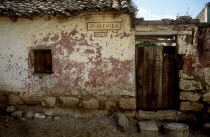 A back street in the outskirts of the Guatemalan town of Xela. A characteristic but crumbling house sits baking in the sun surrounded by large rocks and a dry dusty road. The house itself is worn and...