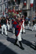 Saint Tropez. Bravade Festival with men in costume marching in a procession Celebrated anually on June the 15th Bravade meaning act of defiance