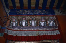 The Potala Palace. Chief residence of the Dalai Lama. Detail of interior decoration with statues