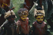 Southern Highlands. Huli Tribe The Wigmen. Children in costume with painted faces at Sing Sing Festival