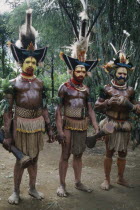 Southern Highlands. Tari. Huli tribemen Wigmen dressed in costume with painted faces and elaborate headresses