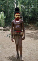 Southern Highlands. Tari. Huli Tribe. Child dressed for Sing Sing Festival wearing face paintIndigenous