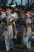 Western Highlands. Mount Hagen. Sing Sing Festival. Tribal men in traditional costumes with face paint and elaborate feather headdresses  Indigenous