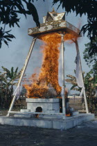Funeral Pyre engulfed in flames at a Buddhist cremation.