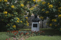 Bust of Irish Poet Thomas Moore who visited Bermuda in 1804 surrounded by yellow flowering bushes. Thomas Moore 1779-1852
