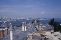 Topkapi Palace.  View across rooftops of the Harem to the Bosphorous. Eurasia
