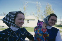 Hutterite women and child from the Milford farming colony near Raymond.  Hutterites are a communal branch of Anabaptists forming male dominated rural colonies.